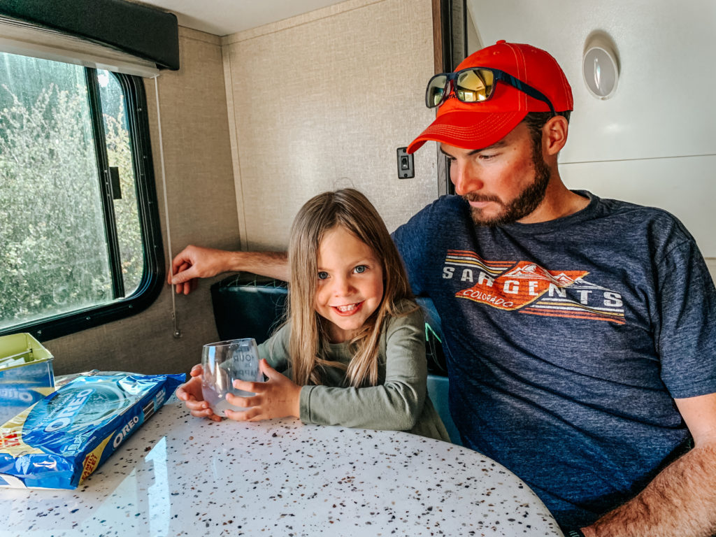 Sitting at dining table in RV camping in Colorado