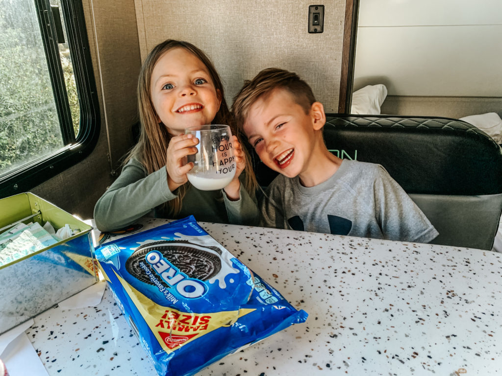 two kids sitting at dining table in RV camping in Ridgway Colorado