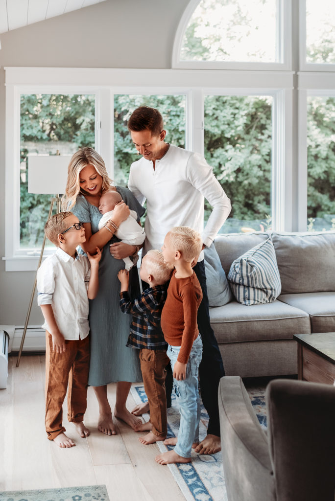 family of six standing together in family room