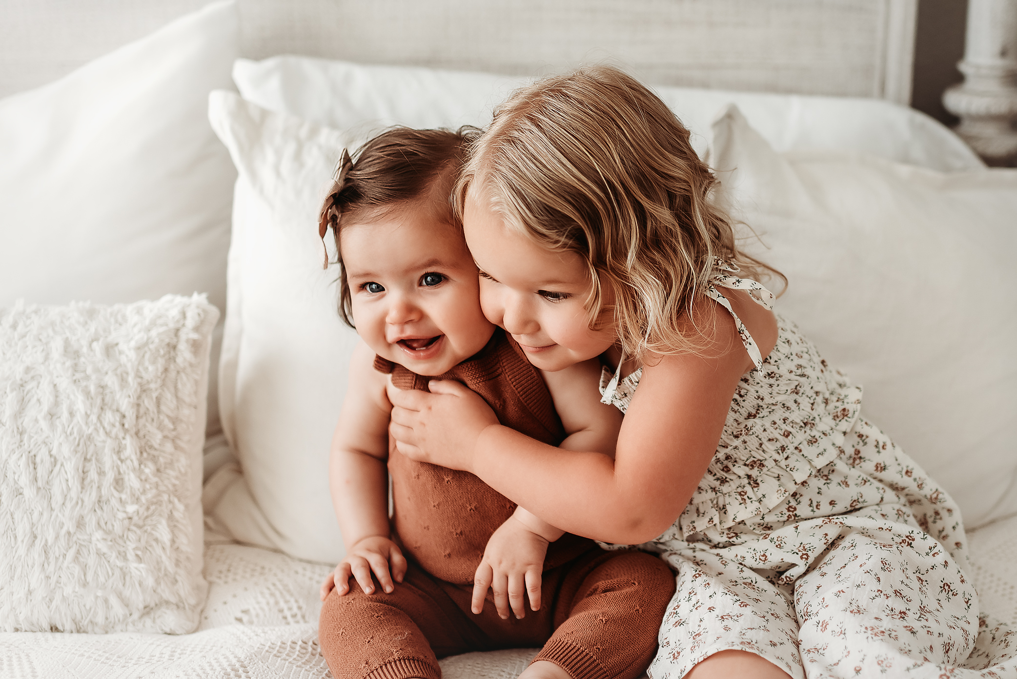 sibling girls hugging in photo studio