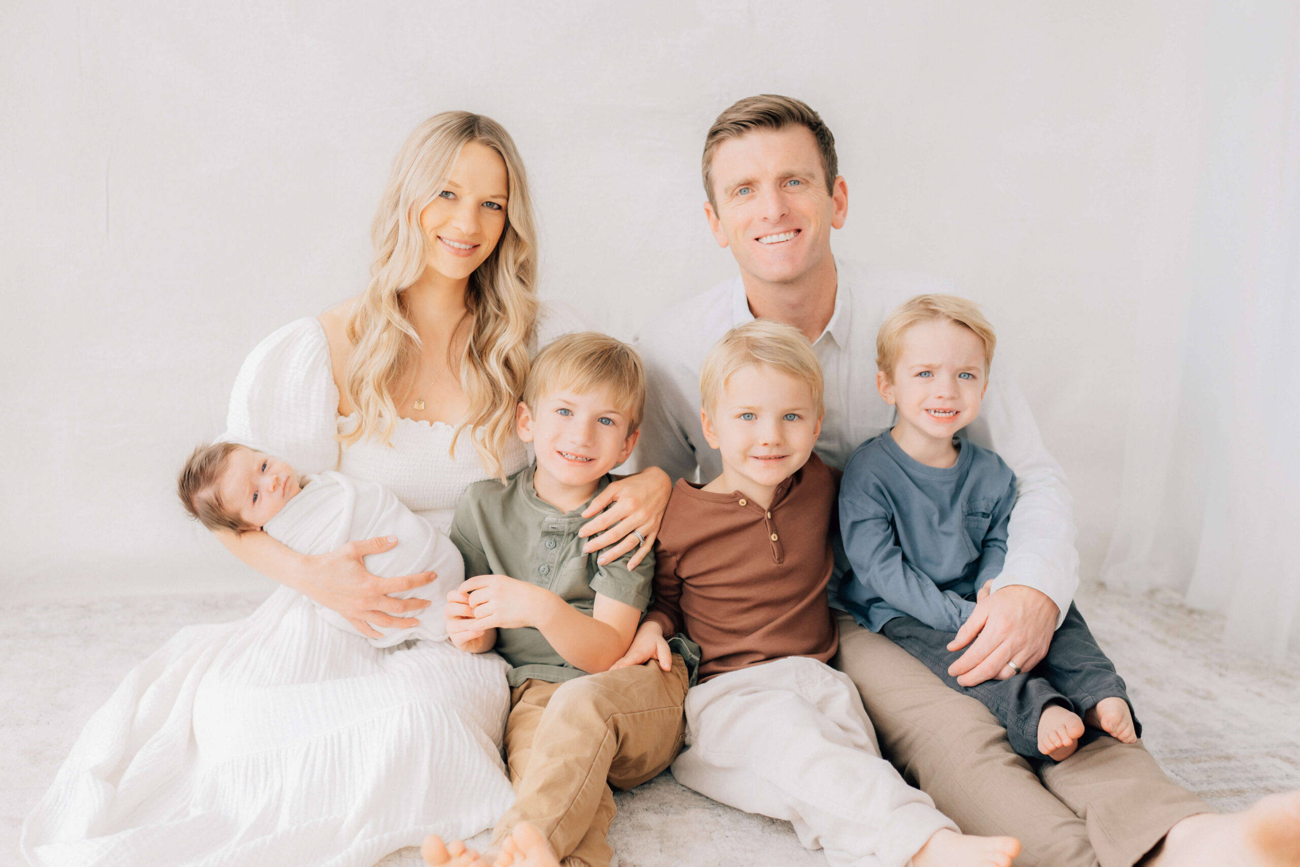 what makes a good portrait of a newborn with family in photographer studio